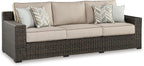 Signature Design by Ashley Coastline Bay Nuvella Weather Resistant Fabric Outdoor Sofa with Cushion and 4 Throw Pillows, Beige & Dark Brown